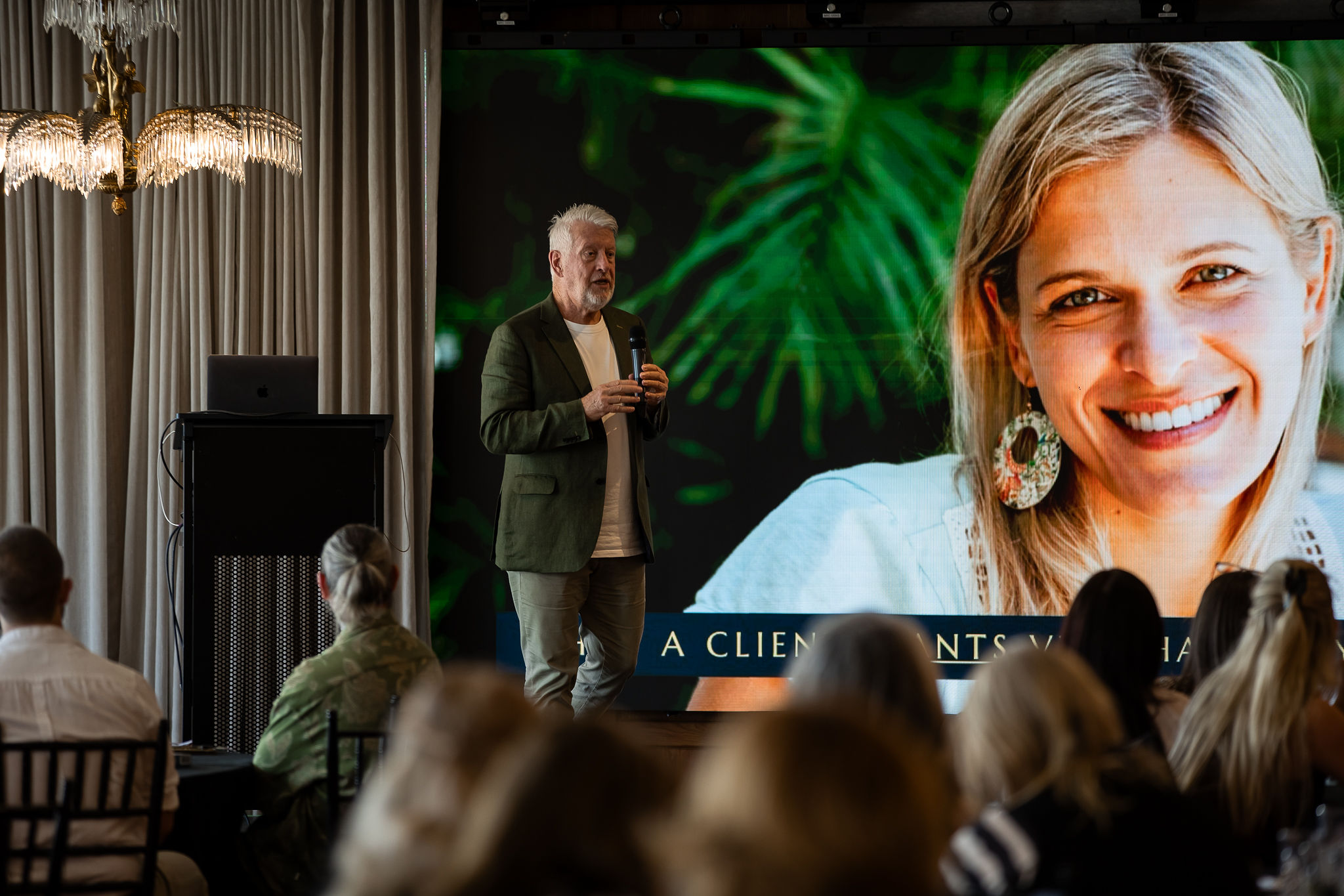 Speaker presenting at the SLAI Conference